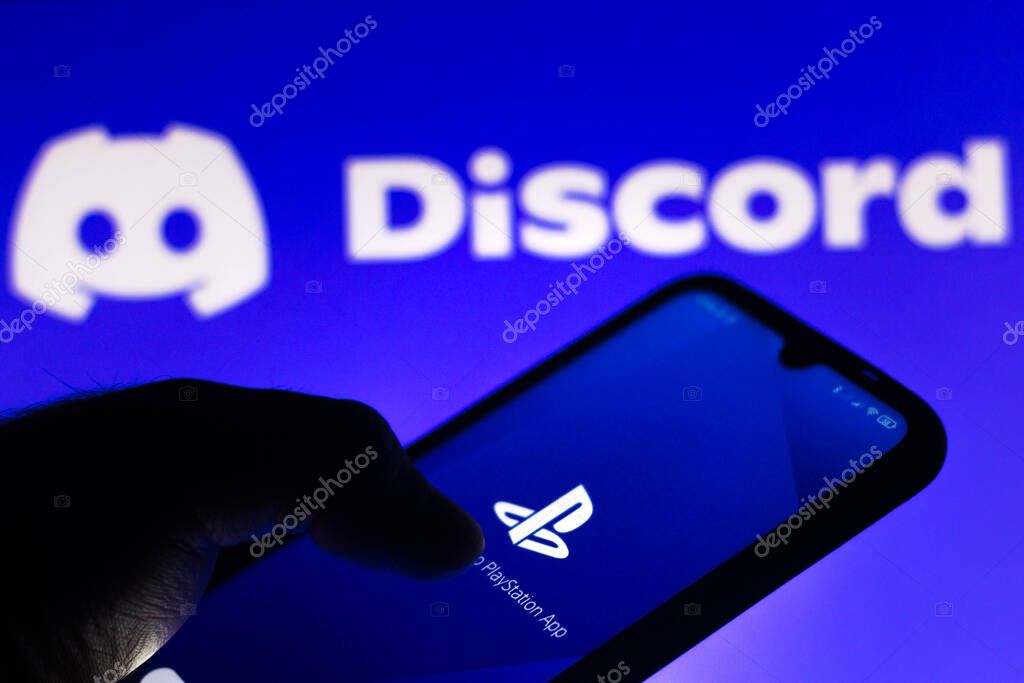 May 21, 2021, Brazil. In this photo illustration the PlayStation (PS) logo app seen displayed on a smartphone screen with the logo of Discord in the background