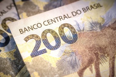 İki yüz reais banknotunun ayrıntıları. Gerçek Brezilya 'nın para birimidir. Merkez Bankası, ülkede gerçeğin bir uzantısı olarak hizmet verecek dijital bir para birimi oluşturma yönergeleri başlattı.
