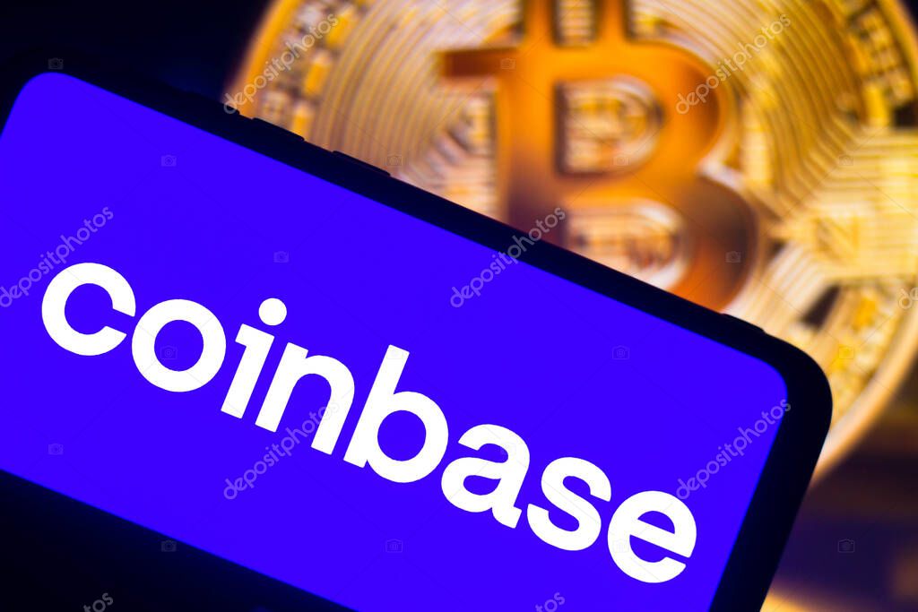 August 7, 2021, Brazil. In this photo illustration the Coinbase logo seen displayed on a smartphone. In the background, a bitcoin cryptocurrency is displayed
