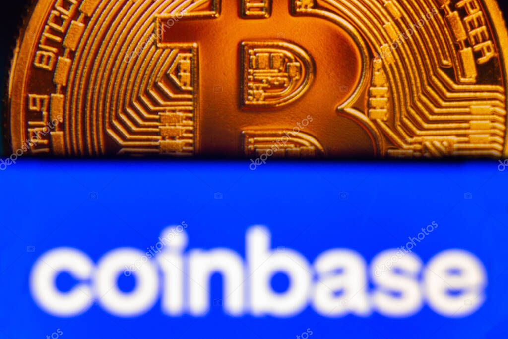 August 7, 2021, Brazil. In this photo illustration the Coinbase logo seen displayed on a smartphone. In the background, a bitcoin cryptocurrency is displayed