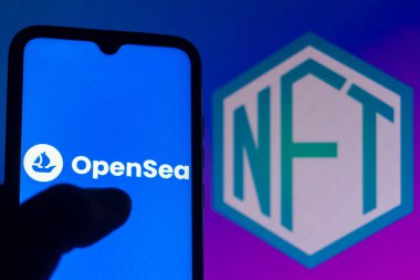 August 23, 2021, Brazil. In this photo illustration the OpenSea logo displayed on a smartphone. In the background the NFT logo (Non-fungible token) clipart