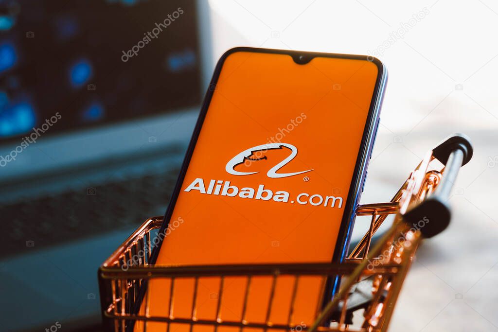 September 2, 2021, Brazil. In this photo illustration the Alibaba.com logo displayed on a smartphone along with a shopping cart