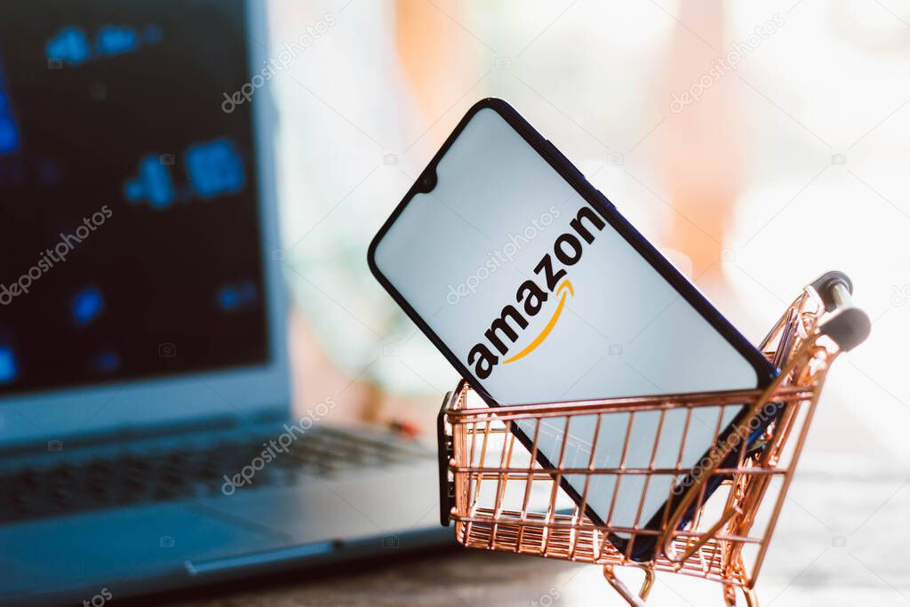 September 2, 2021, Brazil. In this photo illustration the Amazon logo displayed on a smartphone along with a shopping cart