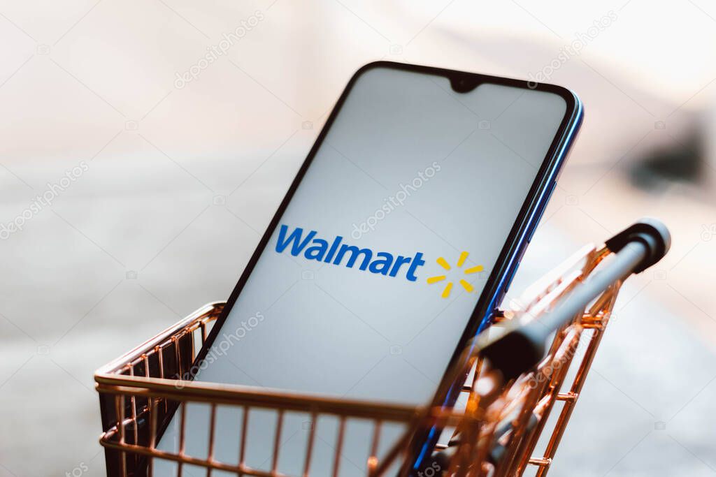 September 2, 2021, Brazil. In this photo illustration the Walmart logo displayed on a smartphone along with a shopping cart