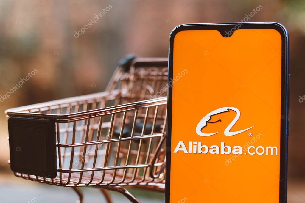 September 2, 2021, Brazil. In this photo illustration the Alibaba.com logo displayed on a smartphone along with a shopping cart