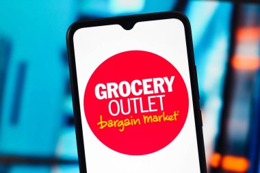 In this photo illustration, the Grocery Outlet logo is seen displayed on a smartphone screen