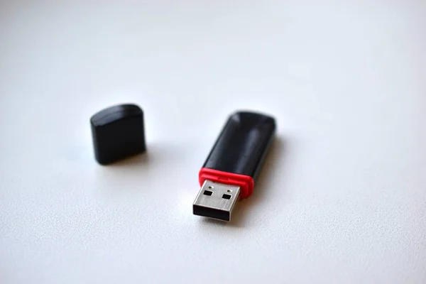 Black flash drive on a white background