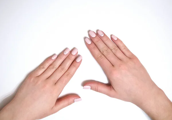 Manicura feminina sobre um fundo branco. Simples — Fotografia de Stock