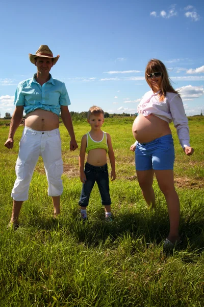 Family compares bellies — Stock Photo, Image