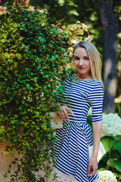 Portrait of a girl with flowers — Stock Photo, Image