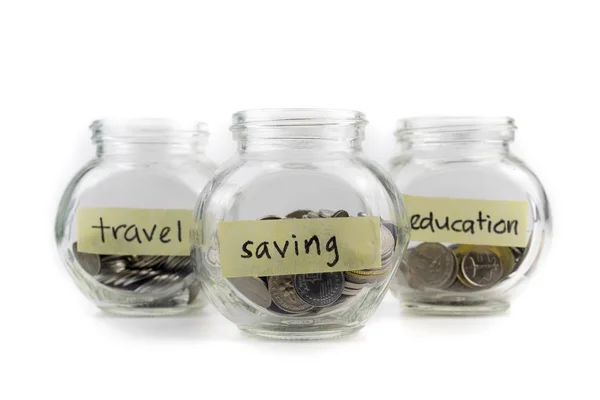 Coins in glass container. — Stock Photo, Image