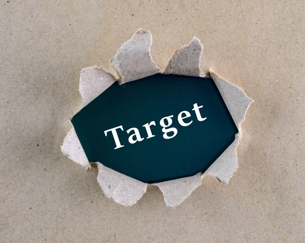 Gescheurd bruin ruw geweven papier met "target" woord op het achtergrond oppervlak. — Stockfoto