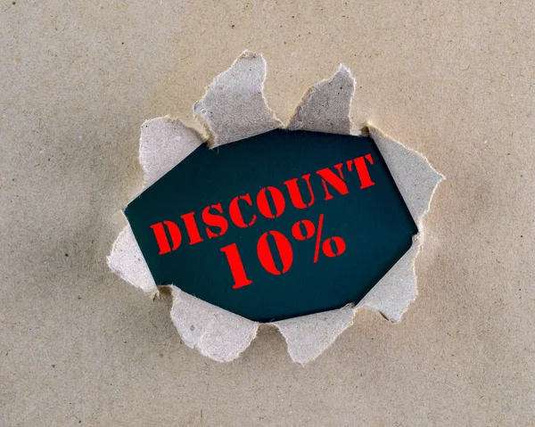 Torn brown rough textured paper with "Discount 10%" words at background surface. — Stock Photo, Image