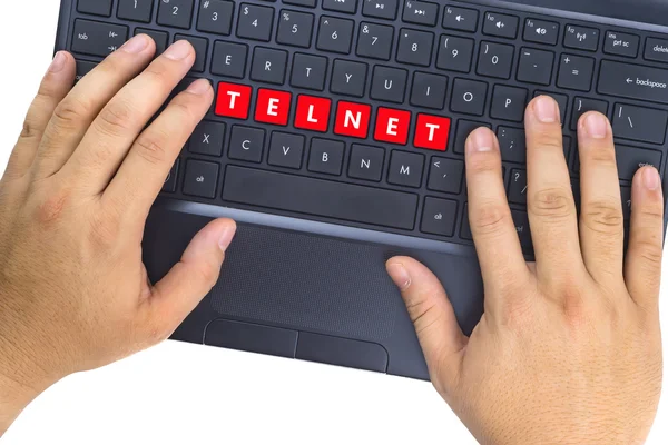 Mãos no laptop com a palavra "TELNET" nos botões do teclado contra fundo branco . — Fotografia de Stock