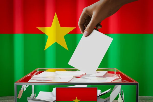 Bandiera Burkina Faso Mano Cadere Scheda Elettorale Una Scatola Voto — Foto Stock