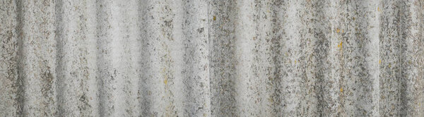 Текстура старого застывшего шифера. Шиферная крыша. Поверхность выветрилась. Серый цвет. Стиль ретро. Фоновое изображение. Шаблон для текста.