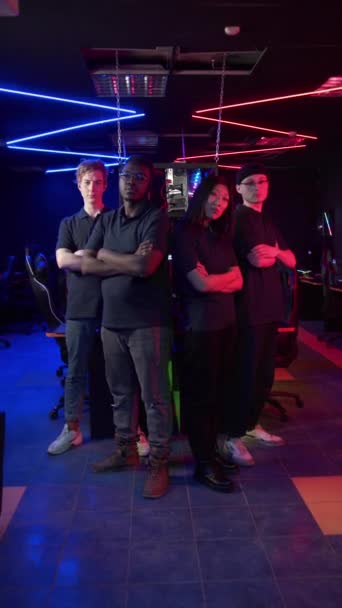 A super cool team of gamers is calling hands to join the world of esports, three guys and a girl, a multinational team — Stock Video