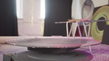 A table is rotating on its axis