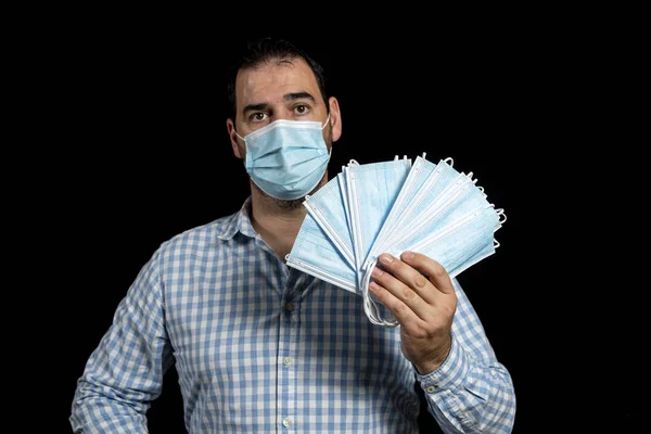 Worried Man Wearing Surgical Mask Protect Himself Coronavirus Holding One — Stock Photo, Image