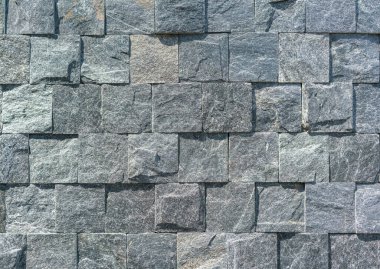 Farklı boyutlarda modern gri taş duvar kare şeklinde.