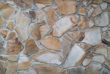 Taş bir duvarın dokusu. Eski kale taşından duvar dokusu. Bir taş duvarın parçası, arkaplan veya doku için