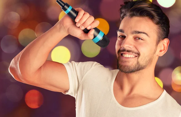 Singer posing with microphone — Stock Photo, Image