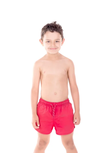 Niño con pantalones cortos de playa — Foto de Stock