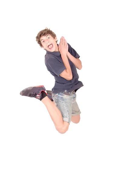 10代の男の子が白い飛び跳ねる — ストック写真