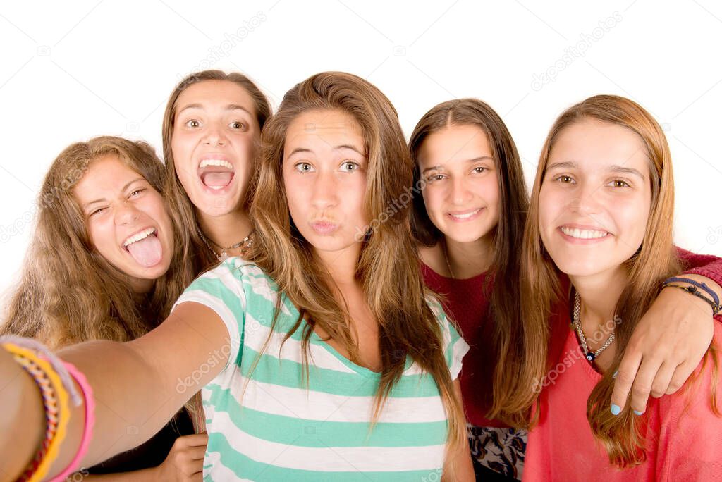 teenage girls taking selfies isolated in white background