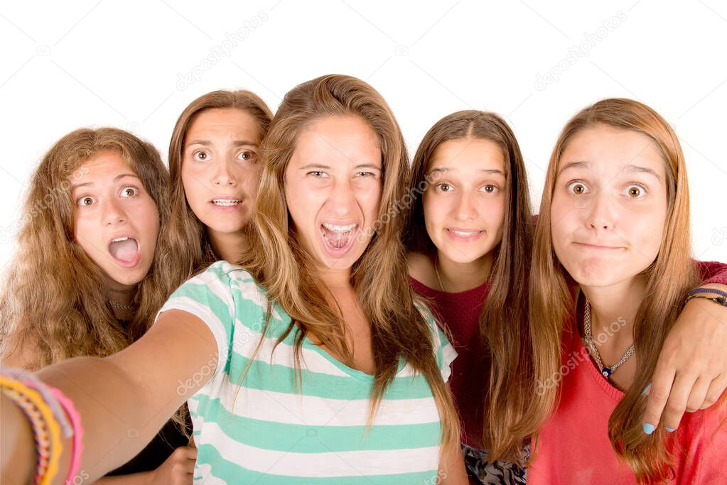 teenage girls taking selfies isolated in white background