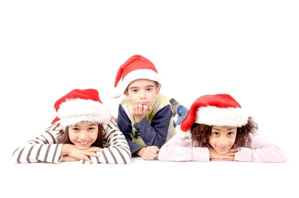 Crianças com chapéu de Natal — Fotografia de Stock