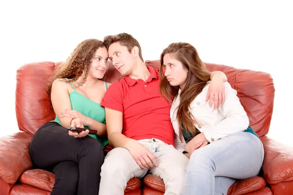 Friends sitting on a couch — Stock Photo, Image