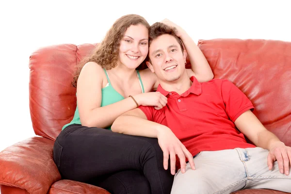 Couple sitting on a couch — Stock Photo, Image