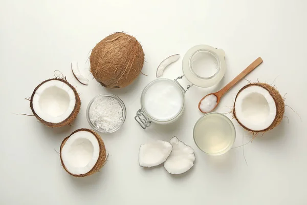 Fresh coconut and coconut milk on white background