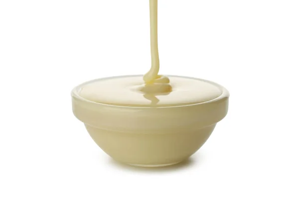 Latte Condensato Versato Ciotola Isolato Fondo Bianco — Foto Stock