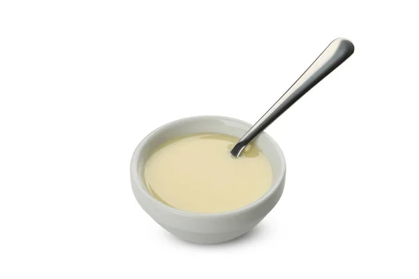 Ciotola Con Latte Condensato Cucchiaio Isolato Fondo Bianco — Foto Stock