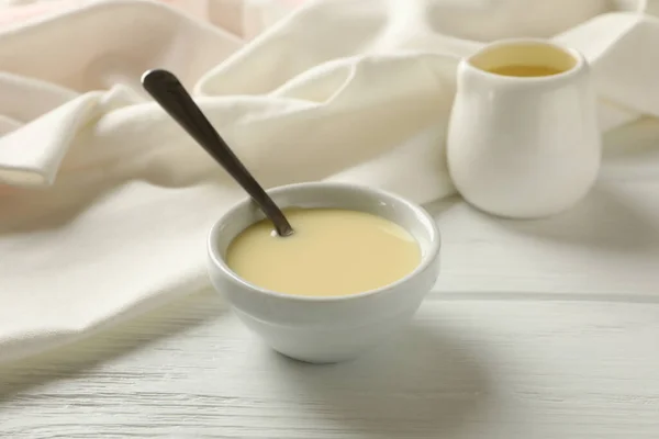 Kitchen Towel Bowls Condensed Milk Wooden Background — Stock Photo, Image