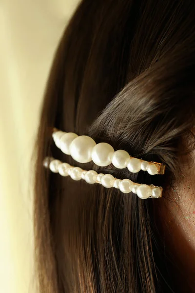 Woman with beautiful hair clip, close up