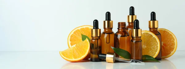 Dropper Bottles Oil Oranges White Table — Stock Photo, Image