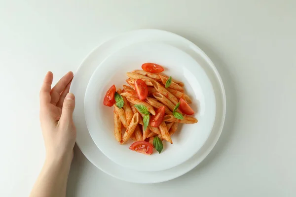Female Hand Plate Pasta Tomato Sauce White Background — Stock Photo, Image