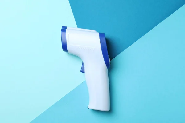 Thermometer Gun Three Tone Background Close — Stock Photo, Image