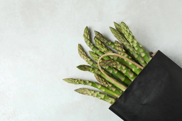 Bag Green Asparagus White Textured Background — Stock Photo, Image