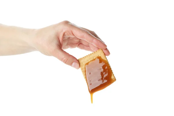 Mão Feminina Segura Biscoito Com Caramelo Isolado Fundo Branco — Fotografia de Stock
