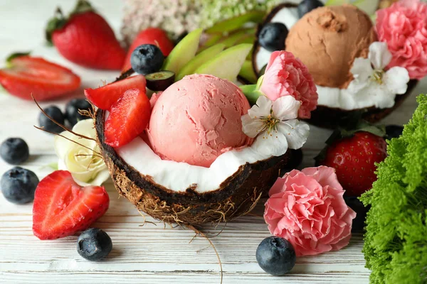Concept of delicious fruit ice cream on wooden table
