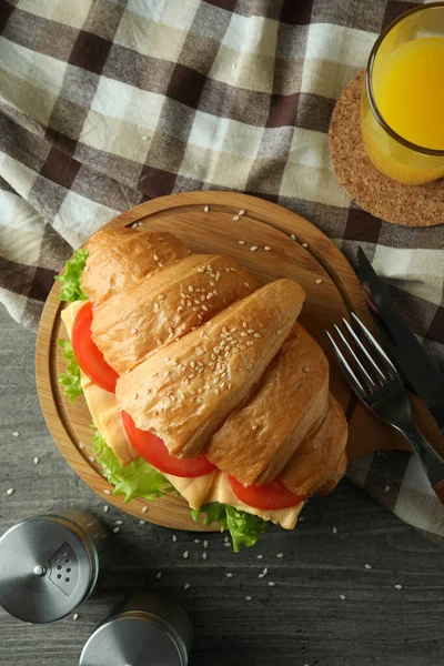 Concept Tasty Eating Croissant Sandwich Gray Textured Table — Stock Photo, Image
