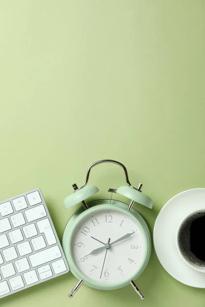 Workplace Concept Alarm Clock Green Background — Stockfoto