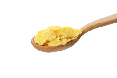 Beyaz arkaplanda mısır gevreği olan kaşık