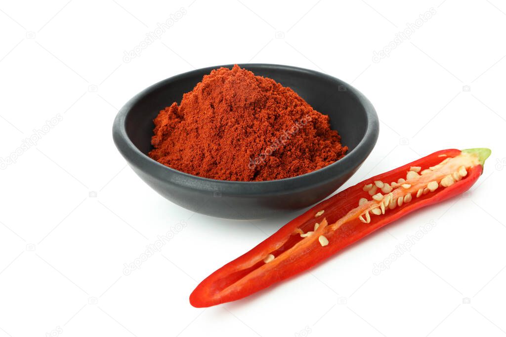 Red hot chili pepper powder and half isolated on white background