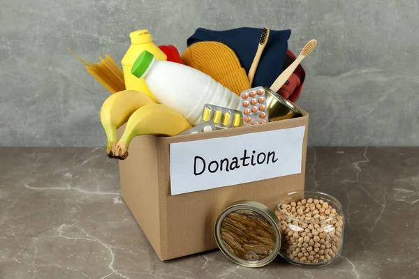 Concepto Donar Con Caja Donación Mesa Texturizada Gris — Foto de Stock