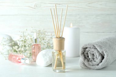 Aromatic concept with diffuser on white wooden table